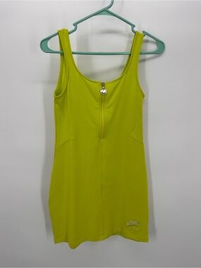 Women’s Nike Air Dress in Atomic Green with front zipper pull.